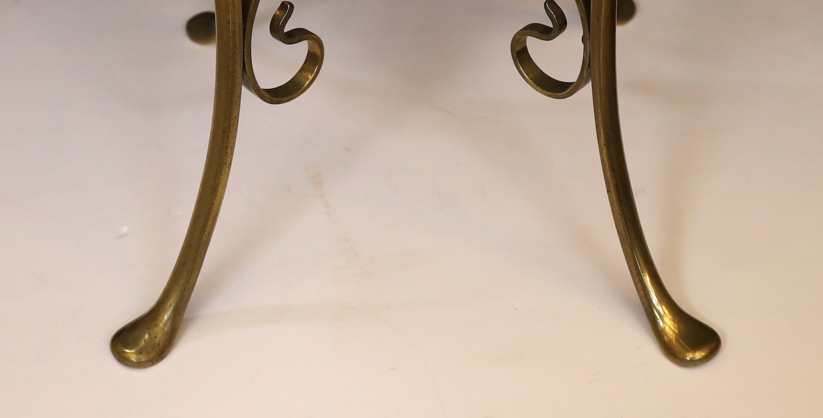 An Edwardian brass and copper telescopic oil lamp standard with scrolling underframe and etched glass globe, height 155cm. width 35cm